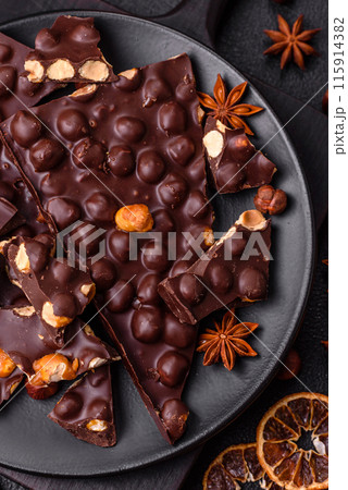Black bitter chocolate with whole hazelnuts, candied fruits and mint 115914382