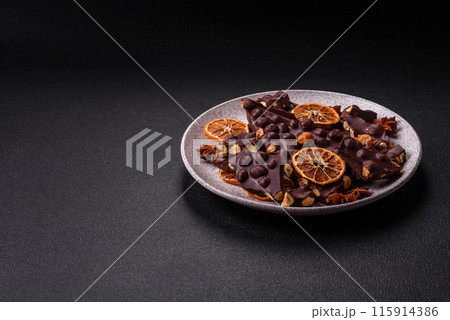 Black bitter chocolate with whole hazelnuts, candied fruits and mint 115914386