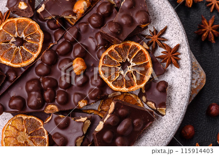 Black bitter chocolate with whole hazelnuts, candied fruits and mint Black bitter chocolate with whole hazelnuts, candied fruits and mint 115914403