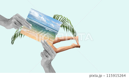 A human hand holding a photo with a beach and a blue sky 115915264