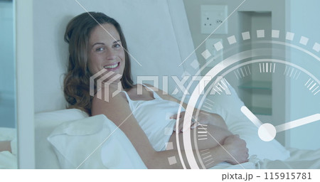 Clock with fast moving hands over happy pregnant caucasian woman lying on bed holding belly Clock with fast moving hands over happy pregnant caucasian woman lying on bed holding belly 115915781