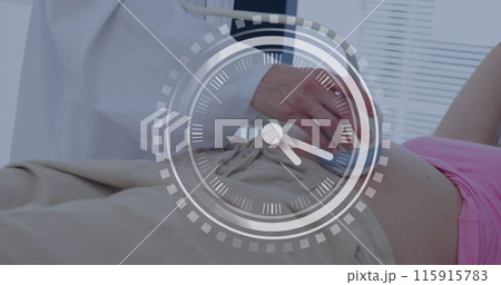 Fast moving hands on clock over caucasian female doctor and pregnant patient having ultrasound scan 115915783