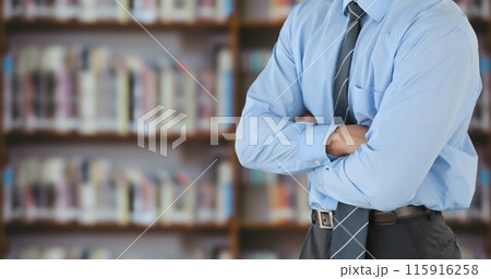 Mid-section of a smart businessman swiping on a digital screen in a library 4k Mid-section of a smart businessman swiping on a digital screen in a library 4k 115916258