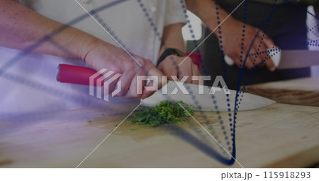 Image of dots forming dna helix over cropped hands of chef cutting vegetable over cutting board 115918293