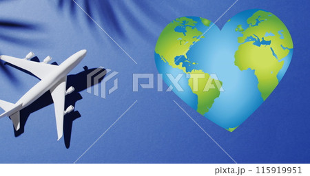 Image of heart of globe over shadow of leaves and plane 115919951