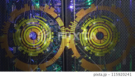 Image of two round scanners spinning against computer server room Image of two round scanners spinning against computer server room 115920241