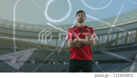 Image of a Caucasian male rugby player standing with crossed arms and looking to camera with hand dr 115920972