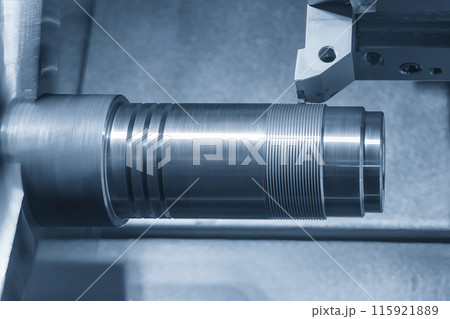 The CNC lathe machine forming cutting the metal shaft parts. The CNC lathe machine forming cutting the metal shaft parts. 115921889