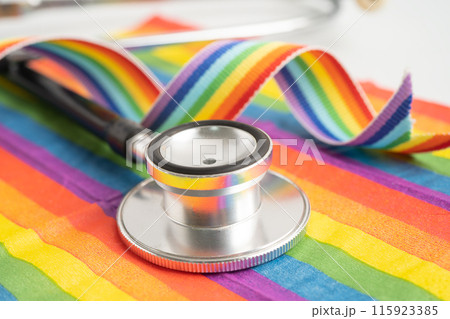 Stethoscope on rainbow flag background, symbol of LGBT pride month celebrate annual in June social, symbol of gay, lesbian, bisexual, transgender, human rights and peace. 115923385