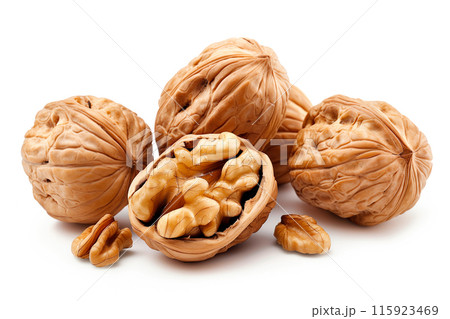 Close-up of shelled and unshelled Walnut nuts isolated on a white background, showcasing their texture Close-up of shelled and unshelled Walnut nuts isolated on a white background, showcasing their texture 115923469