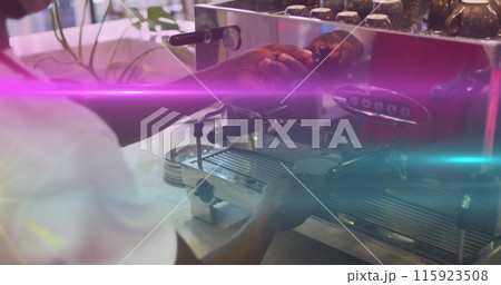 Image of light spots over biracial man using coffee machine 115923508