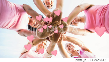 Image of hearts over happy diverse women teaming up Image of hearts over happy diverse women teaming up 115923616