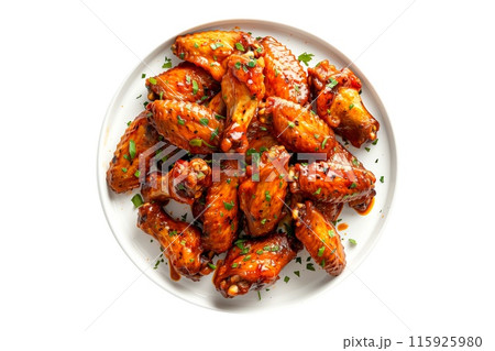 Delicious crispy Nashville Hot chicken wings garnished with fresh cilantro, great for appetizers or main meals 115925980