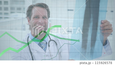 Image of graphs and increasing numbers over caucasian male doctor examining x-ray report Image of graphs and increasing numbers over caucasian male doctor examining x-ray report 115926578