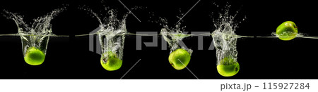 Green apple falling in water on black background Green apple falling in water on black background 115927284