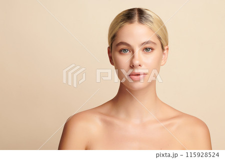 Beautiful young woman with clean fresh skin on beige background, Face care, Facial treatment, Cosmetology, beauty and spa, women portrait. 115928524