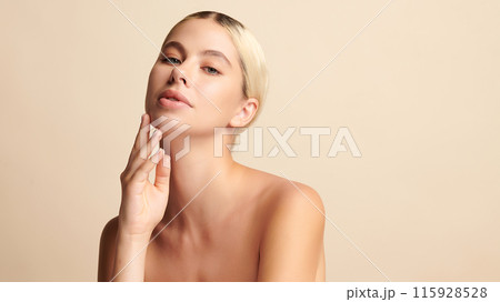 Beautiful young woman with clean fresh skin on beige background, Face care, Facial treatment, Cosmetology, beauty and spa, women portrait. Beautiful young woman with clean fresh skin on beige background, Face care, Facial treatment, Cosmetology, beauty and spa, women portrait. 115928528