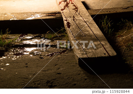 Blood drips on a wooden cross 115928844