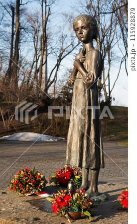 February 19, 2022. Girl with spikelets. Monument near the Holodomor Museum 115928879