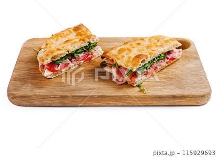 Fresh italian panini sandwich on wooden board 115929693