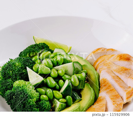 Healthy grilled chicken and green vegetables plate Healthy grilled chicken and green vegetables plate 115929906