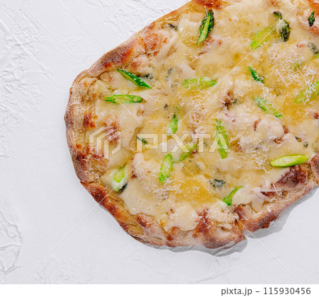 Gourmet asparagus pizza on white background Gourmet asparagus pizza on white background 115930456