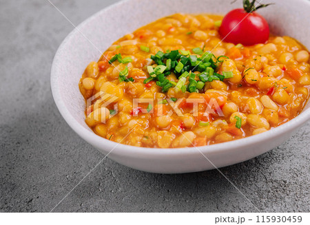 Homemade spicy chickpea stew with garnish Homemade spicy chickpea stew with garnish 115930459