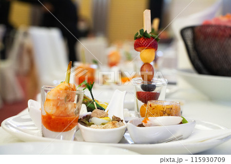 Buffet meals in luxury hotels often include a variety of food options from all over the world.    115930709