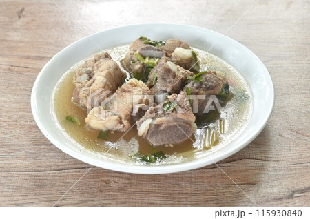 hot and spicy pork bone with tamarind and Thai herbs soup on plate 115930840