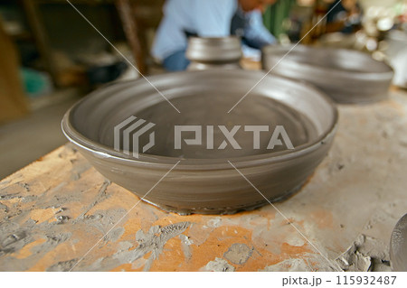 The process of creating pottery. . 115932487