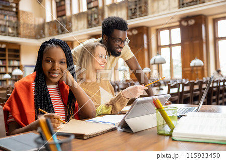 Group of international students working together in the library 115933450