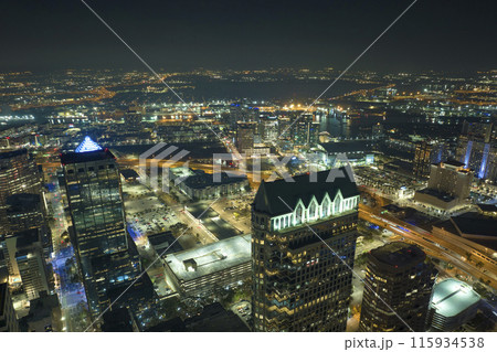 Night urban landscape of downtown district of Tampa city in Florida, USA. Skyline with brightly illuminated high skyscraper buildings in modern american megapolis 115934538