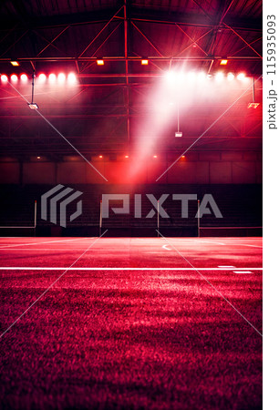 Tennis court with red light coming from the top of the court. 115935093