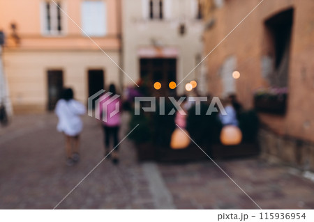 Blurred Defocused background of walking street with crowd people in old town, Background for decorative advertisement. 115936954