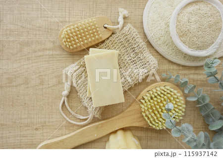 Enjoy a Natural Spa Set with soap, body brushes, and loofah on a wooden background 115937142