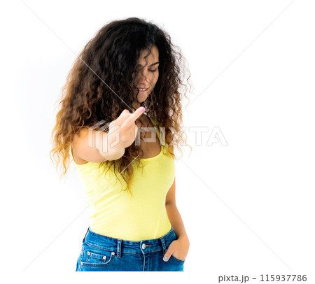 Naughty girl with tongue out showing middle finger Naughty girl with tongue out showing middle finger 115937786