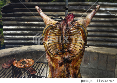 Lamb on the spit, cooked with the traditional Argentine method, La Pampa province, Patagonia, Argentina. Lamb on the spit, cooked with the traditional Argentine method, La Pampa province, Patagonia, Argentina. 115938707