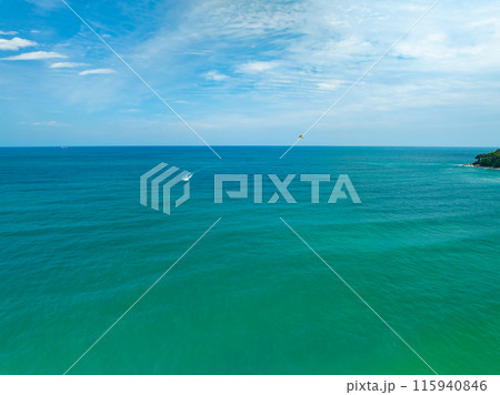 Aerial view of amazing sea surface water texture background,Sun reflections over ocean, Aerial flying drone view Waves water surface texture on sunny tropical ocean in Phuket island Thailand 115940846