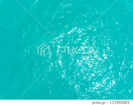 Aerial view of amazing sea surface water texture background,Sun reflections over ocean, Aerial flying drone view Waves water surface texture on sunny tropical ocean in Phuket island Thailand Aerial view of amazing sea surface water texture background,Sun reflections over ocean, Aerial flying drone view Waves water surface texture on sunny tropical ocean in Phuket island Thailand 115940865