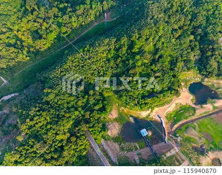Top down of Dam lake mountains with forest green pattern, Beautiful light sunset or sunrise weather, Drone shot aerial view irrigation Nature environment 115940870