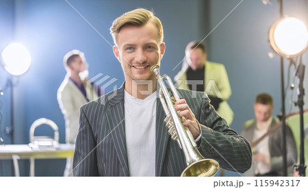 Young musician holding trumpet in a band rehearsal 115942317