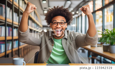 Excited student celebrating success at the library 115942319