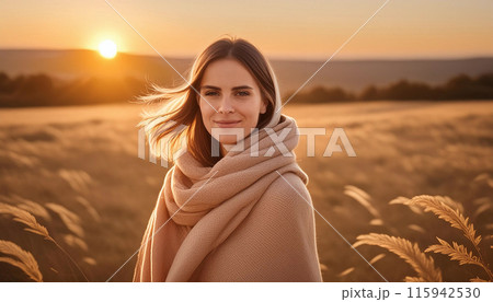 Female wrapped blanket field sunset Female wrapped blanket field sunset 115942530