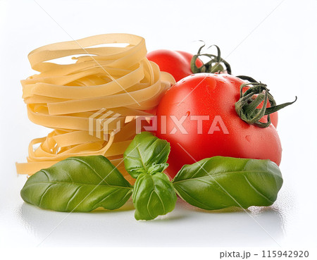 A nest of pasta, fresh basil leaves, and two ripe tomatoes on a white background 115942920