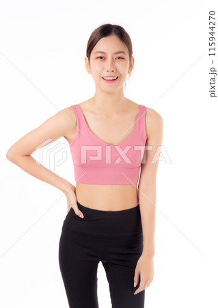 Portrait of beautiful young asian woman in sportswear smile and showing waist and abs isolated. 115944270