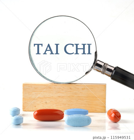 The words Tai Chi concept and theme written it manifested itself in a magnifying glass standing on a wooden bar. The aspect ratio of the photo is 1 to 1 The words Tai Chi concept and theme written it manifested itself in a magnifying glass standing on a wooden bar. The aspect ratio of the photo is 1 to 1 115949531