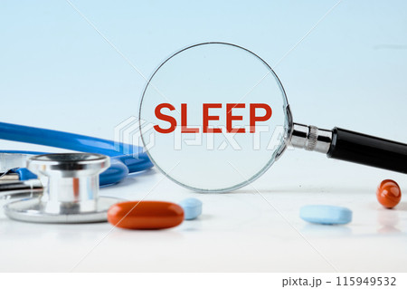 Medicine and health concept. The inscription Sleep through a magnifying glass on a light blue background, next to the pills Medicine and health concept. The inscription Sleep through a magnifying glass on a light blue background, next to the pills 115949532