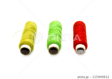 A picture of thread rolls on white background A picture of thread rolls on white background 115949912