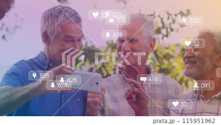 Image of media icons over happy senior diverse men using smartphone 115951962