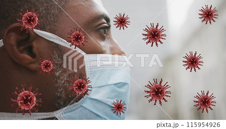 Image of covid 19 cells over african american man wearing face mask 115954926